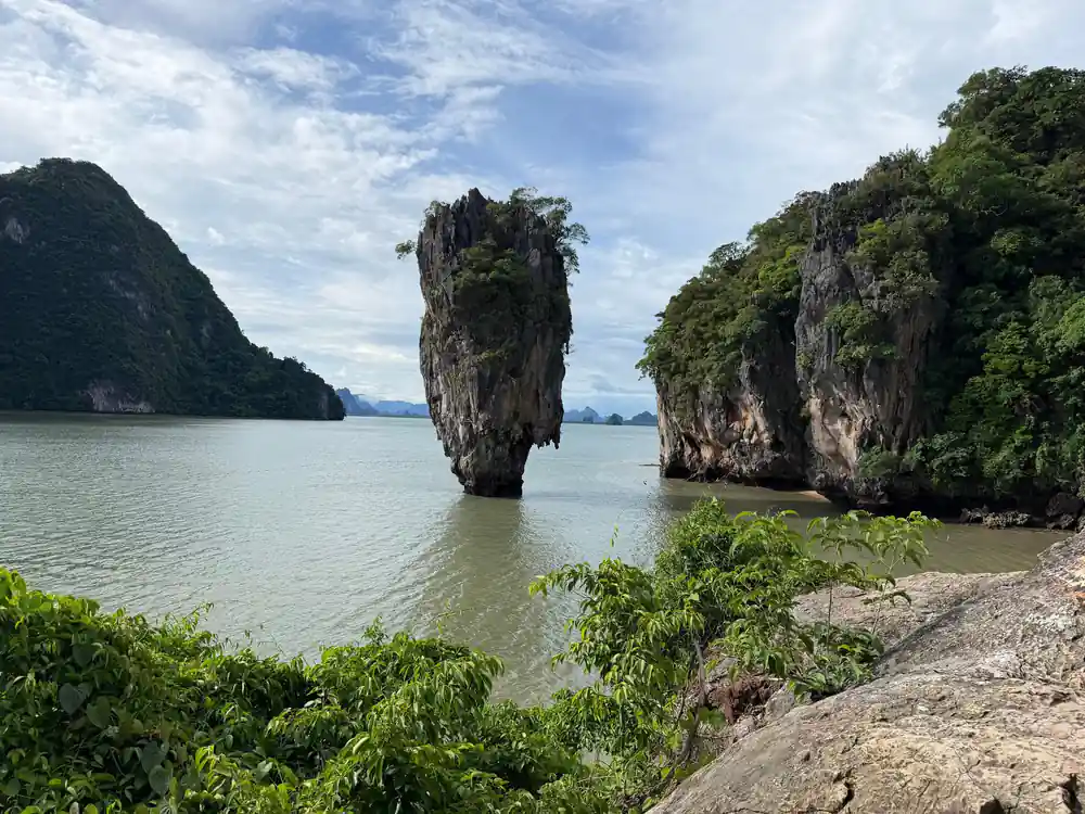 Two limestone islands in green-tinted tropical water